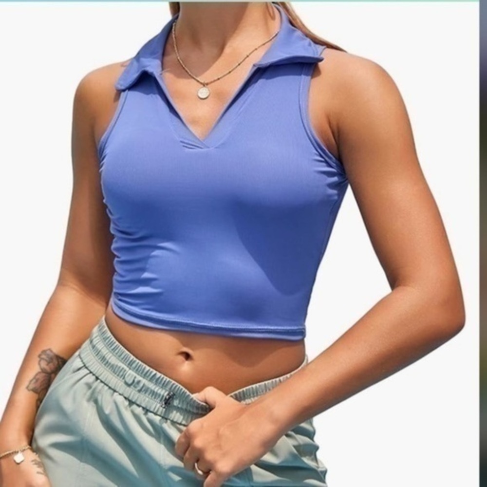 Jessica Simpson collared panned sports top